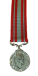 Coast Guard Medal with decorative ribbon on a plain background